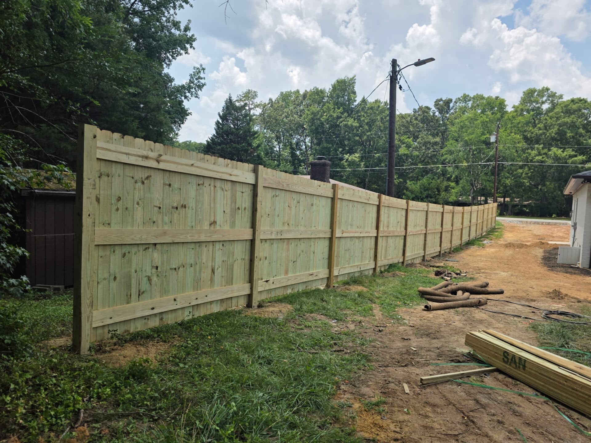 Wood privacy fence install
